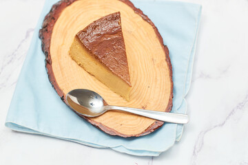 Slice of fresh flan, traditional Mexican dessert.