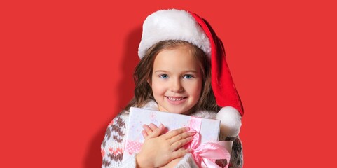 Photo of sweet impressed child giving Christmas gifts