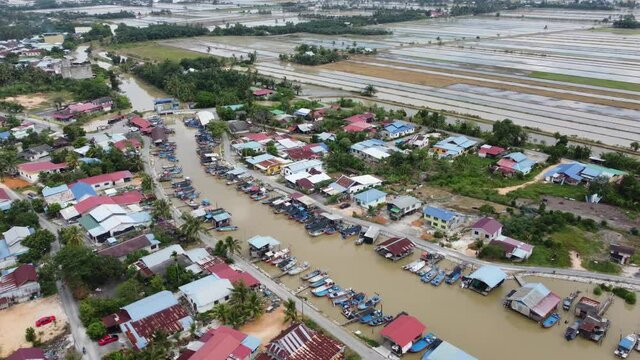 Aerial view fishing jetty and Malays village at Tanjung Piandang, Perak