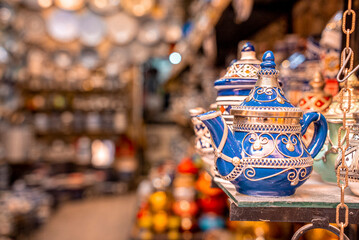 Close up of decorative handcrafted ceramic teapot on shelf for selling at store or local market