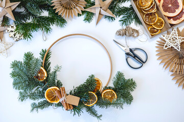Process diy a Christmas wreath from Nordman fir branches. Zero waste decoration concept.