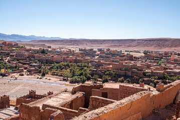 Aerial view of the human settlement homes from historic fortress and mountain range against sky