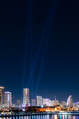 Vertical image of  "NIGHT VIEWING" Laser show at Yokohama Minato-Mirai bay area at night.