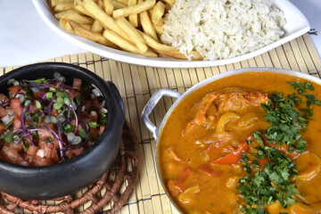 Brazilian seafood stew, fish, rice and chips - Moqueca