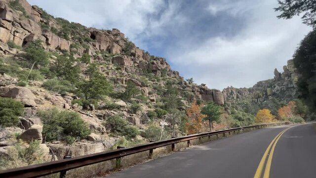Scenic road through Chiricahua National Monument with autumn colors on trees