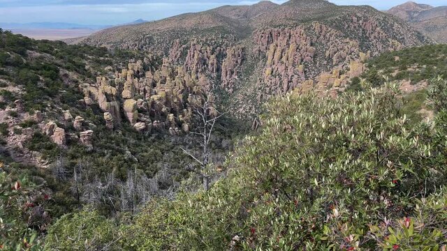 Unique rock formation landscape of Chiricahua National Monument in Arizona, tilt up reveal shot