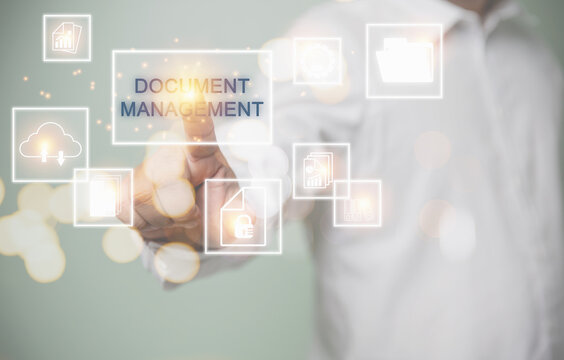 Concept of business document management system, change of document management, business process, business, and technology concept. Businessman touching virtual screen access document system.