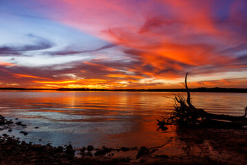 Red sunset at Thunderbird lake in Oklahoma.