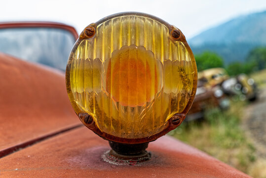 Close up view of a turn signal on an antique truck