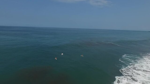 Drone flies above surfers in Playa Hermosa Costa Rica