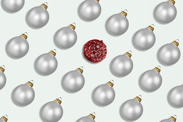 Red and silver shiny Christmas baubles on a pastel background. Christmas decorations.