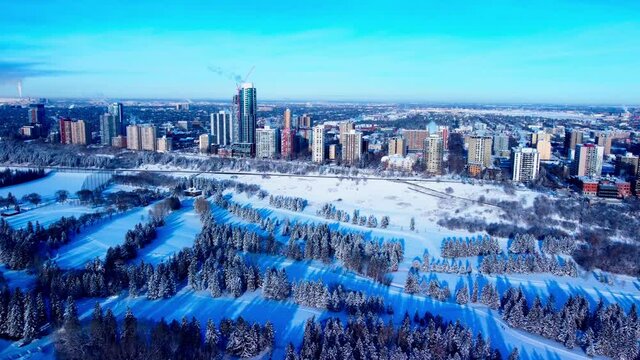 Winter Aerial sunny flyover Victoria Park cross country skiing paths next to the valleys edge most luxurious residential real estate in the Edmonton Westside from 116th St NW to 125th St NW G2-2
