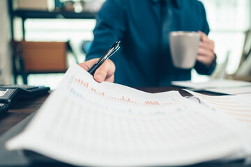 Businessman working on office desk and analyzing new project of accounting finance. Investment,...