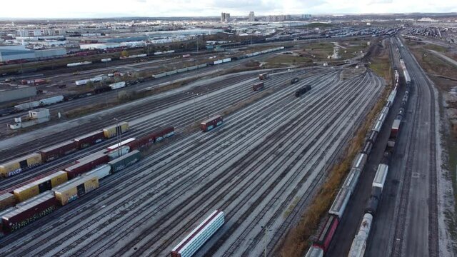 Aerial view passing above MacMillan railroad yard tracks Vaughan, Canada, dolly left