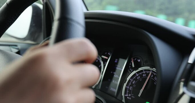 Driving car on highway road, hands holding the steering wheel