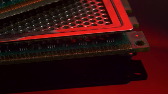 Computer memory RAM module on red light mirror background. Computer hardware, electronic concept. Random Access Memory abbreviated as DDR SDRAM