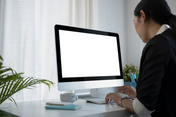 Asian businesswoman working with computer at her workplace.