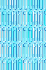 Pop art paper clips on a blue background. 3d rendering illustration.