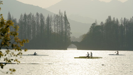 The beautiful lake landscapes in the Hangzhou city of the China in spring with the sunset sunlight