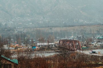 View of the bridge above the Beas river at Patlikuhal village near Manali in Himachal Pradesh, India	