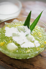 Sago and longan pudding in cup on wooden tray