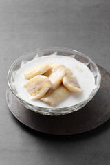 Thai dessert from banana and coconut milk in glass cup