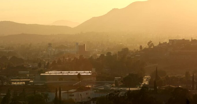 Tecate, Baja California, Mexico - September 14, 2021: Late afternoon sun shines on a bustling downtown Tecate.