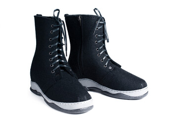 boots with felt laces on a white background