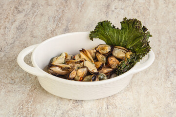 Tasty marinated mussels in the bowl