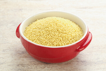 Raw couscous in the bowl