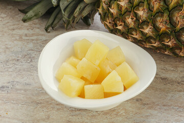 Marinated pineapple slices in the bowl