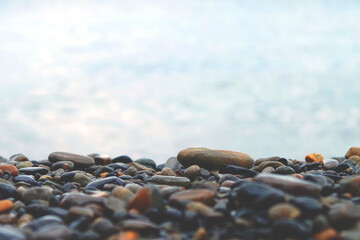 stones on the beach with sea background  and copy space