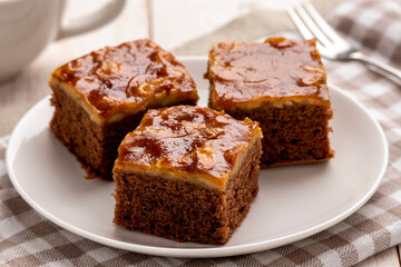 Mini mocha cashew toffee cake, easy to make crunchy, buttery, caramelly cashew crust on top of the moist and tender mocha cake, served on a white plate. It has coffee, caramel and butter in one place.
