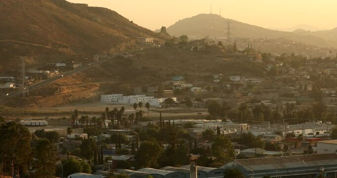 Tecate, Baja California, Mexico - September 14, 2021: Late afternoon sun shines on a bustling downtown Tecate.