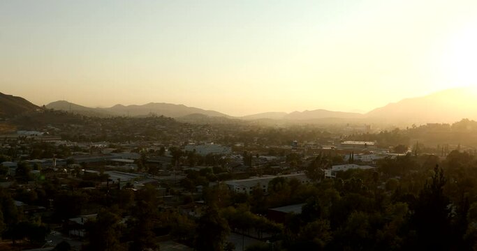 Tecate, Baja California, Mexico - September 14, 2021: Late afternoon sun shines on a bustling downtown Tecate.
