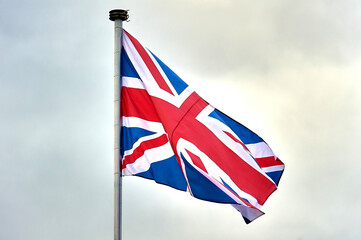 the flag of Great Britain is flying on the flagpole