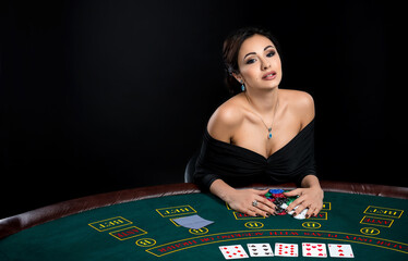sexy woman with poker cards and chips