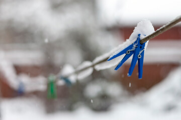  laundry pins covered with snow