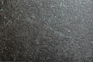 Background Stone wall background with abstract spots. Beautiful gray marble texture with stains, abstract surface background. Finishing stone for building cladding. Furniture granite.