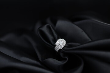 High jewelry banner with color natural gemstone and diamonds on gold ring setting. Black satin...