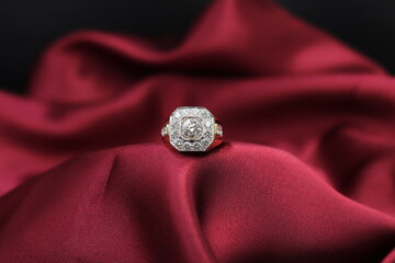 High jewelry banner with color natural gemstone and diamonds on gold ring setting. Red satin...