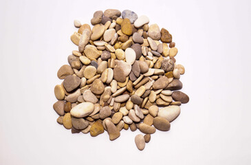 Pebbles, sea pebbles. A handful of stones on a white background.
