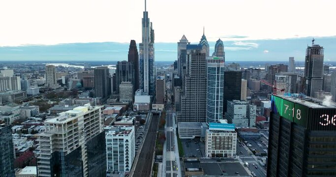 Aerial city establishing shot in USA. Cold winter temperature scrolls on digital sign. Skyline cityscape.