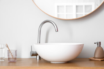 Sink in interior of light bathroom