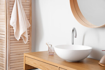 Sink in interior of light bathroom