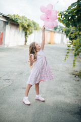 girl with balloons,  portrait of a woman holding a balloon