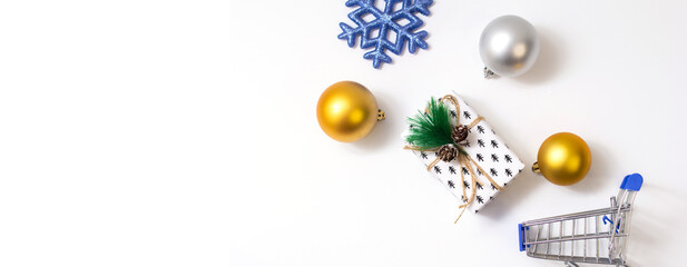 Christmas and New Year shopping, cart with podvarkas and Christmas balls 