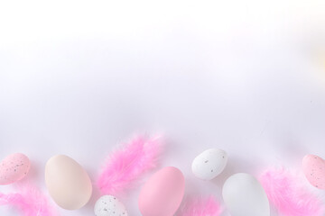 Flatlay of Easter eggs and feathers