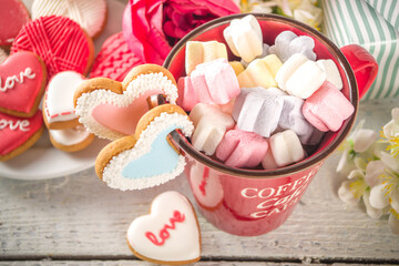 Valentine day background with Tender Pink Red White Peony Flowers and Heart Shaped Valentine Day Decor, Wooden White Background copy space