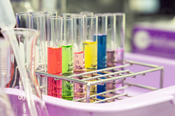 Glass flasks equipment in science chemical laboratory or medical research lab with colorful liquid for research and development concept.